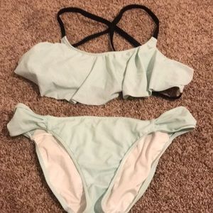 Super cute suit with ruffle top and strappy back